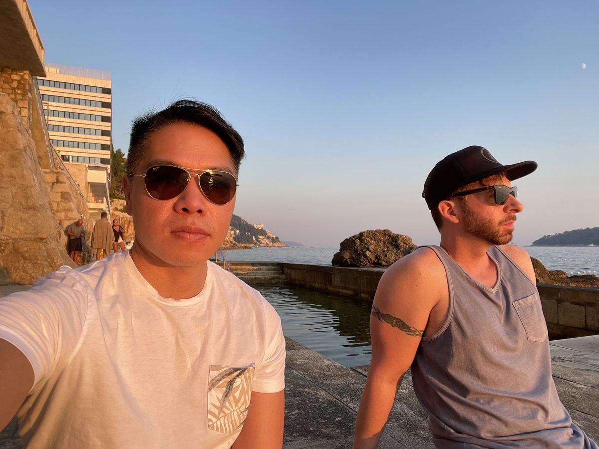Benny and his partner by the Adriatic at golden hour in Dubrovnik